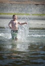 Boy running into ocean Royalty Free Stock Photo