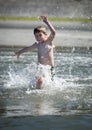 Boy running into ocean Royalty Free Stock Photo