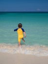 Boy running into ocean Royalty Free Stock Photo