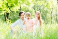 Boy running and playing on meadow with the family Royalty Free Stock Photo