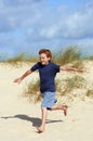 Boy Running On Sand At Beach Royalty Free Stock Photo