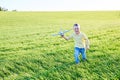 Boy runs with toy airplane in summer through field. Happy child running and playing with toy airplane outdoors. Boy dreams of Royalty Free Stock Photo