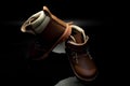 Boy`s boots in nubuck leather isolated on black background, closed