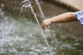 Boy's fatty hand playing with water