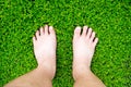 Boy`s feet standing on grass Royalty Free Stock Photo