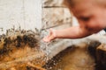 Boy`s hand in the stream of splashing water