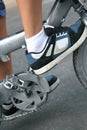 Boy's sneakers and bicycle pedals
