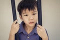 Boy sad behind the iron bar Royalty Free Stock Photo