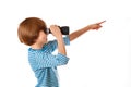 Boy in sailor's striped vest is looking through binocular Royalty Free Stock Photo