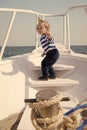 Boy sailor striped shirt sea yacht travel around world. Little sea traveller. Beach is calling and we must go. Baby boy