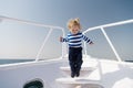 Boy sailor striped shirt sea yacht travel around world. Little sea traveller. Memories made together last lifetime. Baby