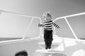 Boy sailor striped shirt sea yacht travel around world. Little sea traveller. Memories made together last lifetime. Baby