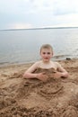 Boy on sandy beach of Lake Seliger Royalty Free Stock Photo