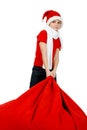 Boy in Santa Claus hat with Christmas Gift Bag Royalty Free Stock Photo