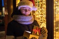 Boy in Santas hat with gifts box looking and dreaming Royalty Free Stock Photo