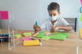 Boy at school wearing protective safety mask - Focus on face