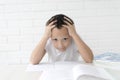 Boy schoolboy teaches lessons writing in notebook and reading books