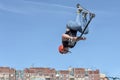 Boy on scooter flips in the air Royalty Free Stock Photo