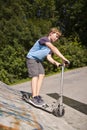 Boy is scooting Royalty Free Stock Photo