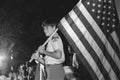 Boy Scout carries the American flag