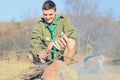 Boy Scout Cooking Sausages on Stick over Campfire Royalty Free Stock Photo