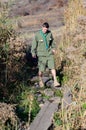 Boy Scout Crossing Creek on Wood Plank Footbridge Royalty Free Stock Photo