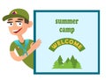 Boy scout holding a banner with an invitation to summer camp Royalty Free Stock Photo