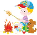 Boy-scout roasting bread on campfire Royalty Free Stock Photo