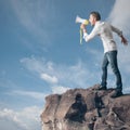 Boy screaming on the megaphone Royalty Free Stock Photo