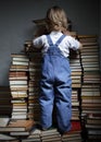 Boy searches books on library