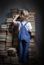 Boy searches books on library