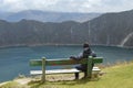 Boy, seat, Quilotoa crater, lagoon, emerald Royalty Free Stock Photo