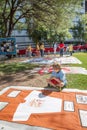 Boy with Section of AIDS Quilt