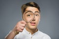 Boy See Through Magnifying Glass, Kid Eye Looking with Magnifier Lens over Gray Royalty Free Stock Photo