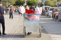 A Boy Is Selling Cotton Candy With His Handcart