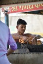 Boy selling Indian fast food kachori