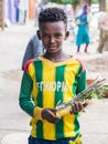 A boy selling mefakia, a natural wooden toothbrush used in Ethiopia