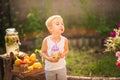 Boy sells homemade lemonade close-up and copy space. The boy in the summer makes homemade lemonade. Children`s games with lemonade