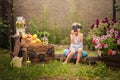 Boy sells homemade lemonade close-up and copy space. The boy in the summer makes homemade lemonade. Children`s games with lemonade