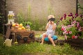 Boy sells homemade lemonade close-up and copy space. The boy in the summer makes homemade lemonade. Children`s games with lemonade