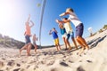 Boy serving the ball during beach volleyball match Royalty Free Stock Photo