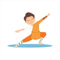 Boy In Shaolin Monk Orange Clothes Doing Meditative Tai Chi Exercise On Karate Martial Art Sports Training Cute Smiling