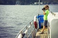 Boy on the ship photographing water Royalty Free Stock Photo