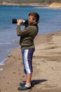 Boy shooting with camera. Royalty Free Stock Photo