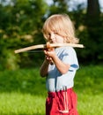 Boy shooting with crossbow Royalty Free Stock Photo