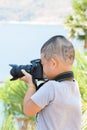 Boy shooting Photo outdoors