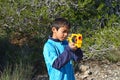 Boy Shooting A Toy Nerf Gun