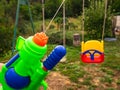 Boy shooting water dispersion with water gun Royalty Free Stock Photo