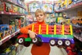 Boy in shop with toy truck Royalty Free Stock Photo