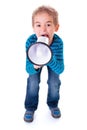 Boy shouting into big white megaphone Royalty Free Stock Photo